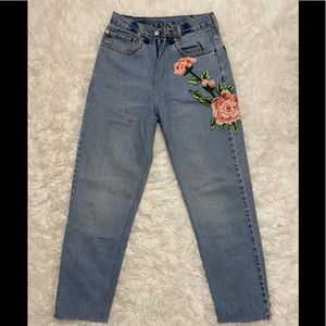 A re-touch design jean with flowers.